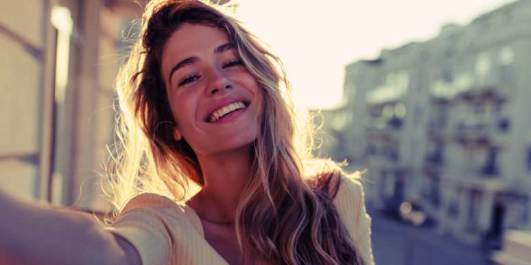 psychological tips for managing fight-flight-freeze instincts woman smiling on European street