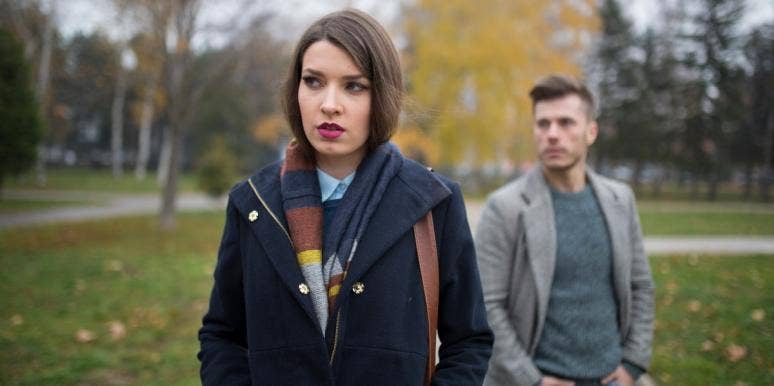managing expectations in a relationship sad-looking woman with man behind her