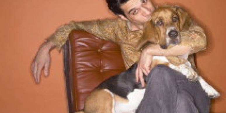Pet Jealousy And How To Deal With It Man sitting with dog