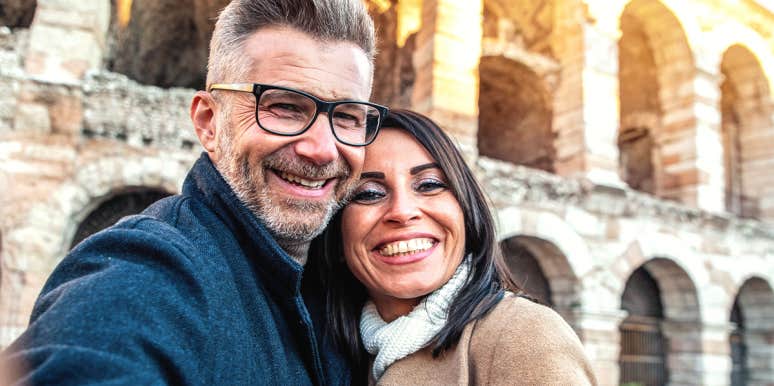 4 Secrets Everyone In Happy Marriages Know smiling couple posing for photo