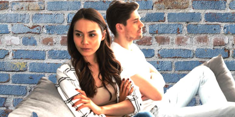 7 Common Marriage Killers And What To Do About Them unhappy couple with brick wall in the background