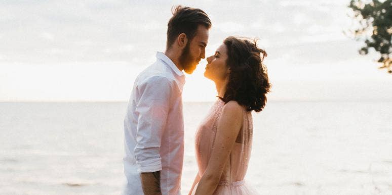 How Marriage Got Me Out Of Severe Debt couple kissing on beach