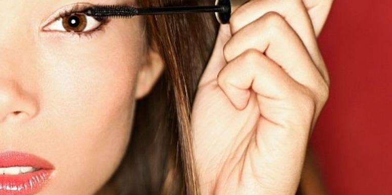 Date Night: 5 Mascaras That Won't Sweat Off Your Face woman putting on mascara