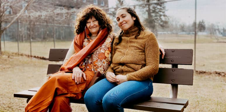 Author and Sue sitting on a park bench together