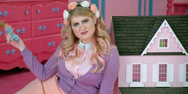 Meghan Trainor playing with a dollhouse in her "All About That Bass" music video