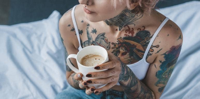 44 Best Memorial Tattoos For Loved Ones Who Passed Away woman with tattoos holding coffee