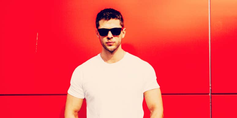 How men set themselves up for failure man in sunglasses standing in front of a red-orange wall