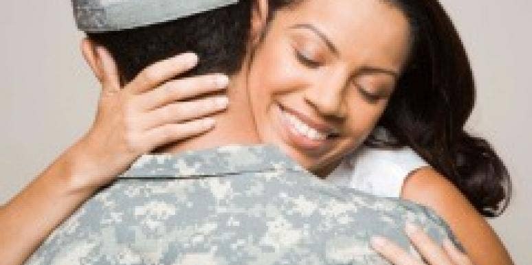 military couple embracing military couple embracing