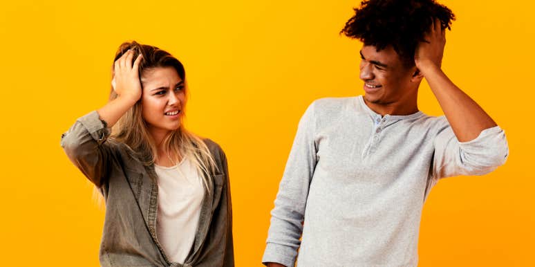 man and woman looking at each other confused over misunderstandings in their relationship