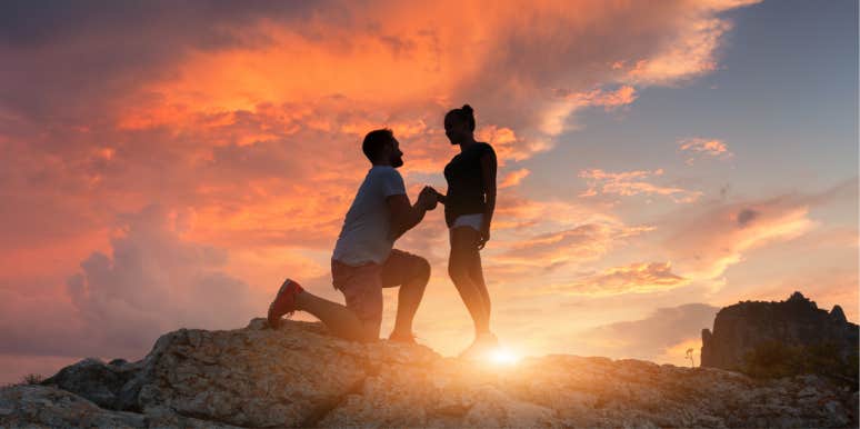 A couple proposing at sunset