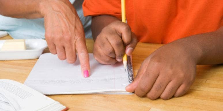 mother helping child with homework mother helping child with homework