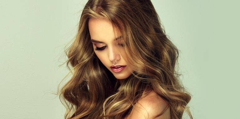What The World's Most Attractive Face Looks Like, According To Plastic Surgeons attractive woman looking down