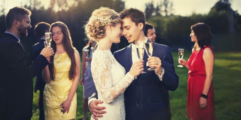Woman's Mother-In-Law Praises Her Son's Ex-Girlfriend In Wedding Reception Speech bride and groom kissing at wedding