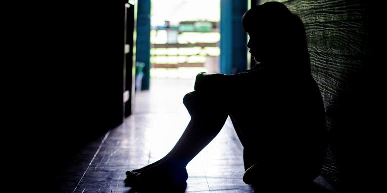 My Abusive Father Beat Me As A Child — But Now I'm Facing My Fears Head-On sad little girl in hallway