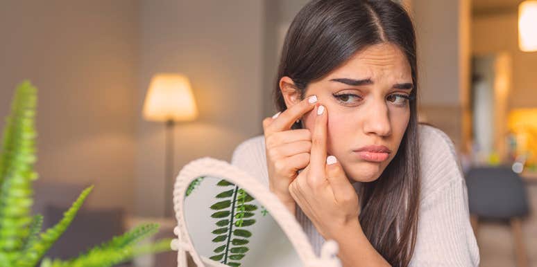 My Dermatillomania Destroyed My Skin, but Not My Self-Esteem woman touching her face