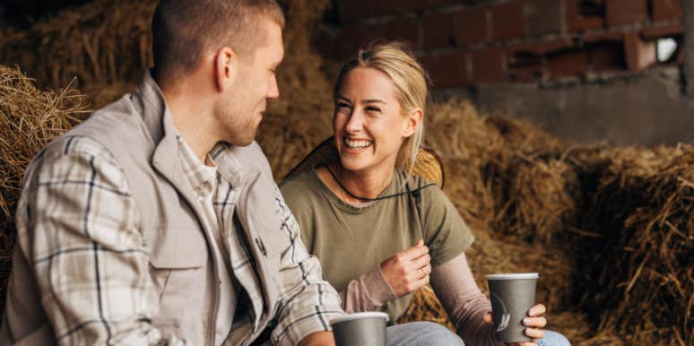 couple drinking coffee in a barn