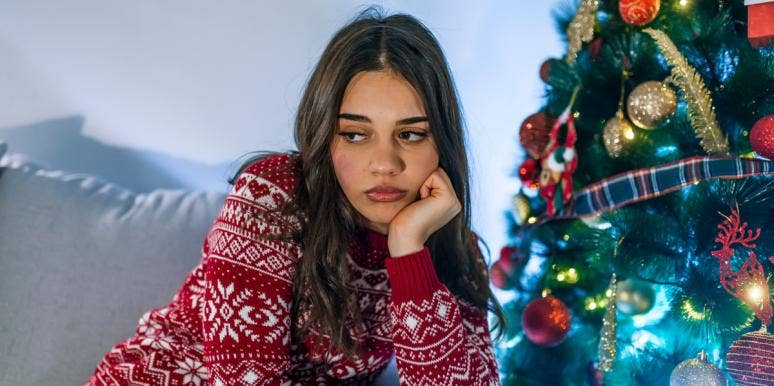 My Toxic Family Ruined the Holidays for Me sad woman near christmas tree
