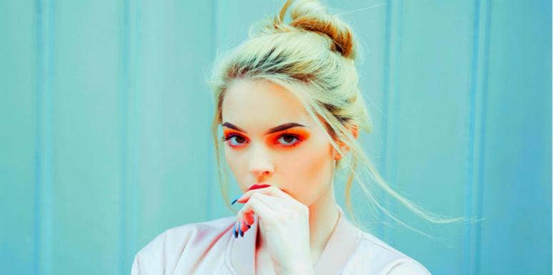 6 Myers Briggs Personality Types Who Always End Up In A Bad Relationship woman with red eyeshadow