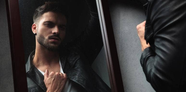 How To Spot A Narcissist With These 9 Behaviors man looking in mirror
