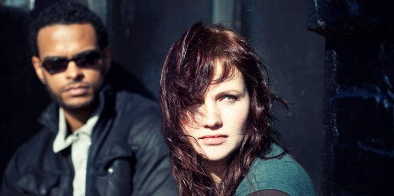 narcissistic rage windswept woman with man behind her