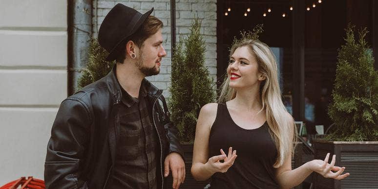 What Happened When I Tried 'Negging' Guys To Get A Date woman and man in black talking