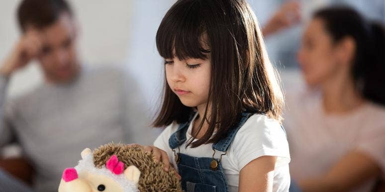 What Is Nesting? The Divorced Parenting Technique That Helps Children Adjust sad girl with divorced parents