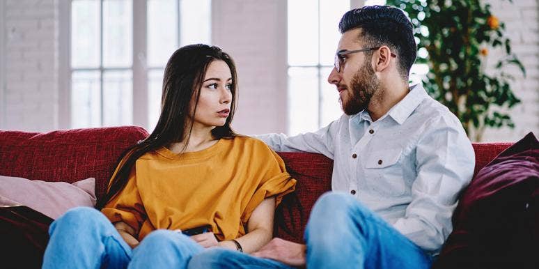 The Psychological Damage Of Marrying A Man Whose Mom Never Said 'No' couple arguing on a couch