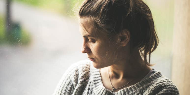 I Met A New Kind of Grief When My Daughter Was Diagnosed With A Rare Disease grieving woman