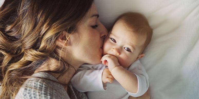 I'm Not The Mother I Thought (And Hoped) I'd Be mother kissing baby