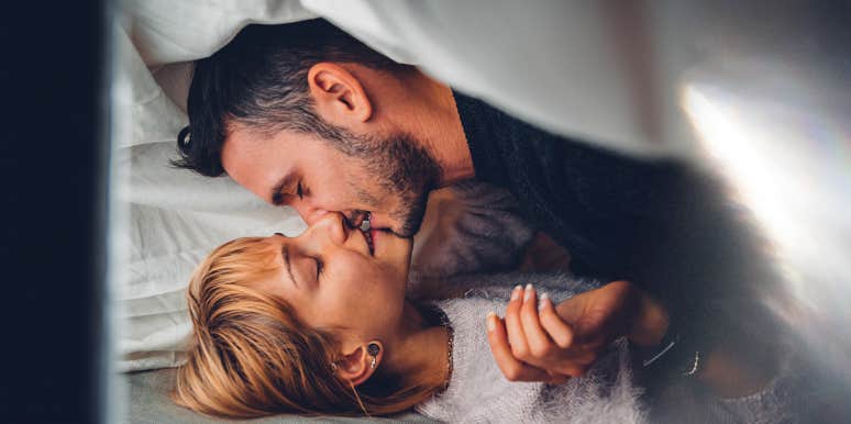 man and woman kissing