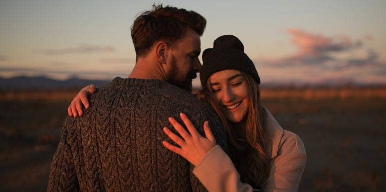 10 Most Common Early Dating Mistakes Women Make couple hugging during golden hour