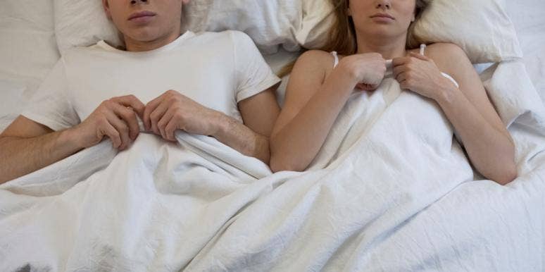 The One Gigantic Mistake Everyone Makes Before Going To Bed couple in bed