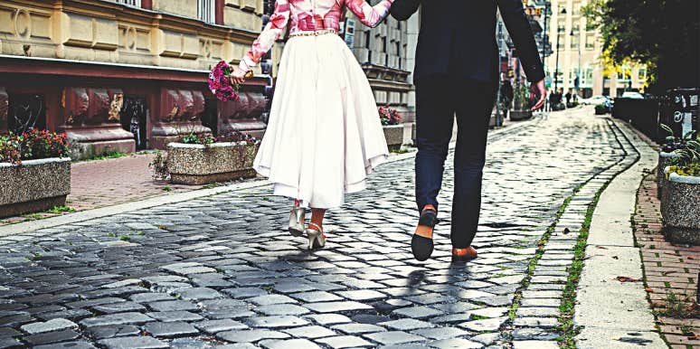 Goodbye letter to the man I thought I'd marry man and woman walking away on cobblestones