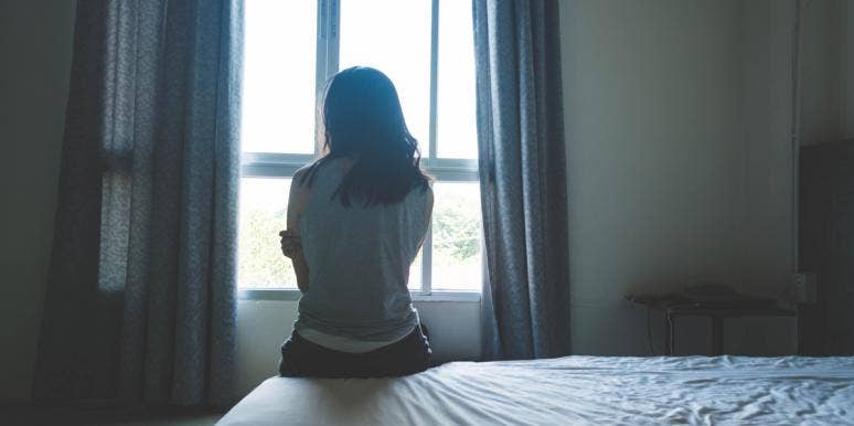 An Open Letter To A Father, From The Daughter You Left Behind woman sitting on bed
