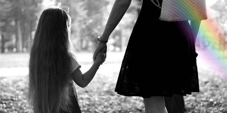 The Day I Outed My Gay Mother mother and daughter holding hands