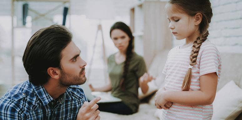 Parents scolding child Parents scolding child