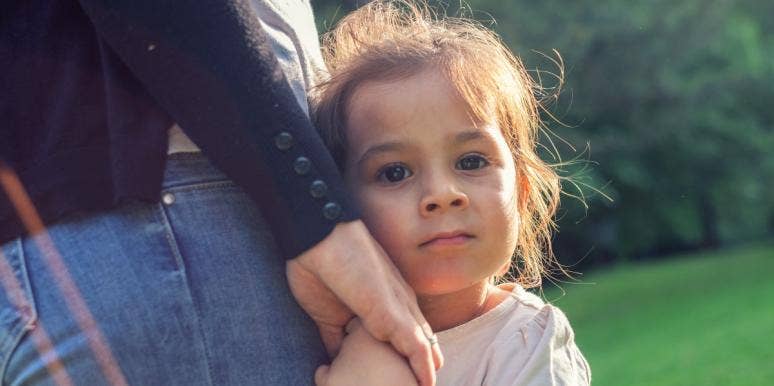 parenting a special needs child little girl holding her parent's hand