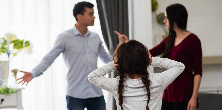 20 Signs You Have A Toxic Parent girl listening to parents arguing