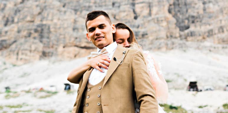 What happens when you're with someone who brings out toxic traits couple in dressy clothes standing in front of snowy cliff