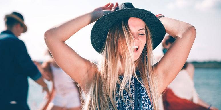 I Missed My 'Soulmate Window' Because I Was Too Busy Having Fun woman in hat having fun