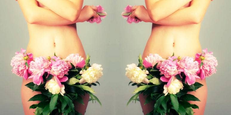 woman with flowers covering her vagina