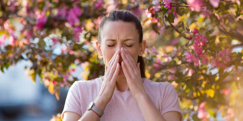 Spring Is Coming And So Are Your Allergies — But Picnic's Personalized Treatment Plan Can Help Woman with allergies under trees