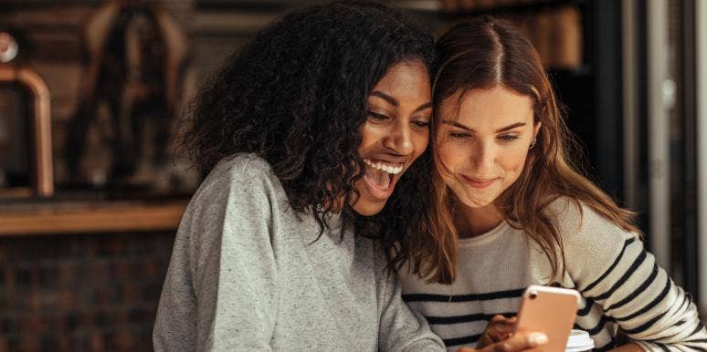 15 Signs You've Found Your Platonic Soulmate two friends looking at a phone