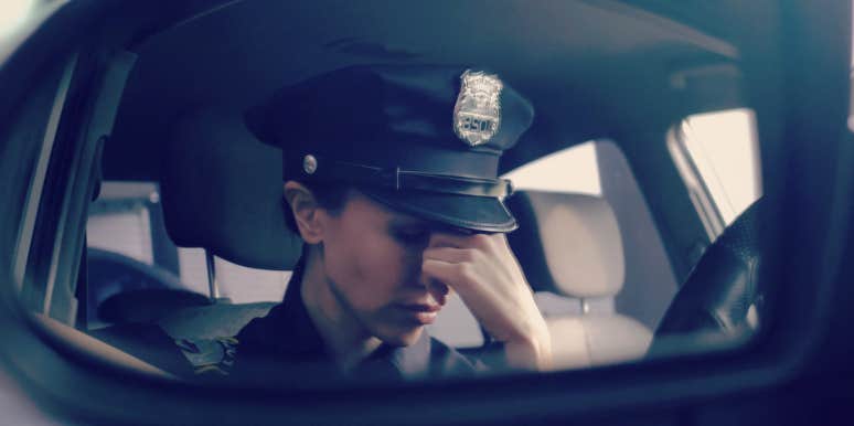 how cops can manage on the job stress cop in the front seat of her car, looking stressed