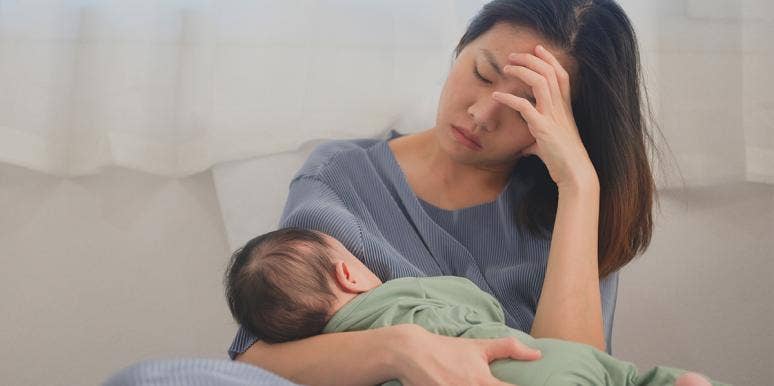 Postpartum Depression Almost Killed Me — Until I Did This overwhelmed woman with baby