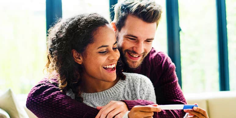 Pregnancy changes life Couple smiles at positive pregnancy test