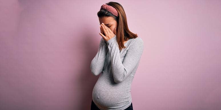 I Got Pregnant In College So I Wouldn't Have To Face Real Life pregnant woman with face in hands