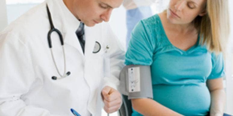 pregnant woman with doctor in clinic