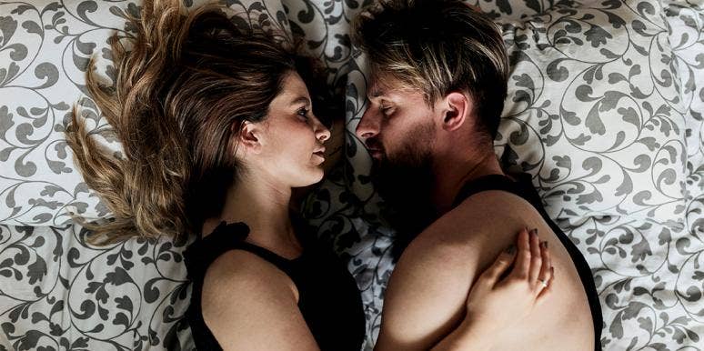 I'm A Professional Cuddler For A Living man and woman cuddling in bed