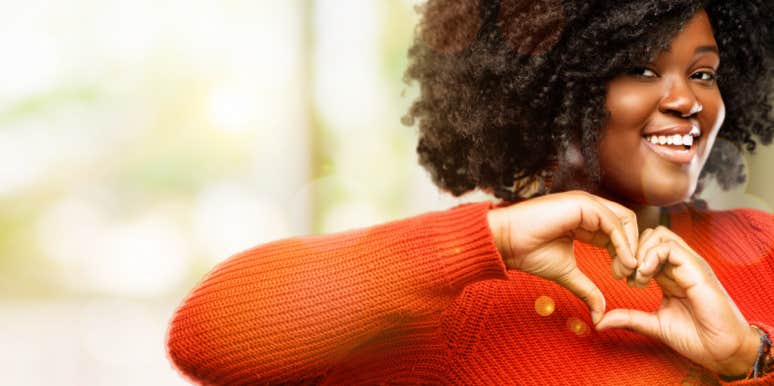 Channel Your Empathic Side smiling woman makes heart with her hands
